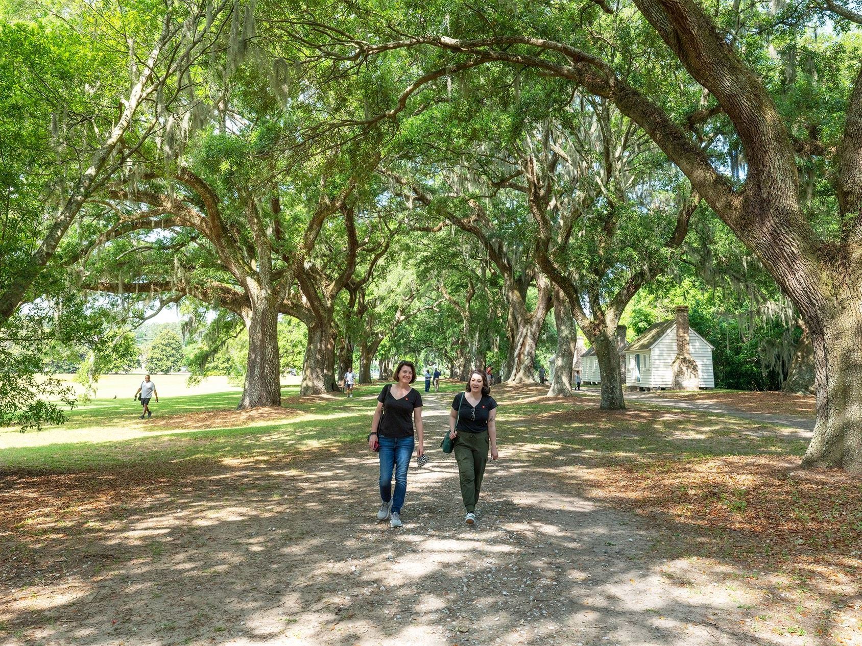 Two ladies walk the paths at McLeod Plantation Historic Site