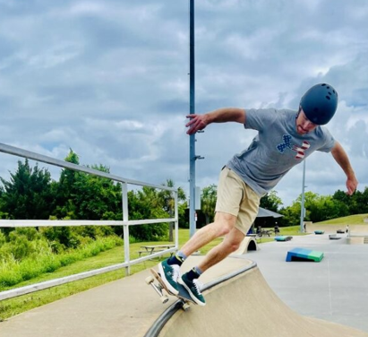 Bobby Joly an instructor skates on a ramp at Skate Charleston