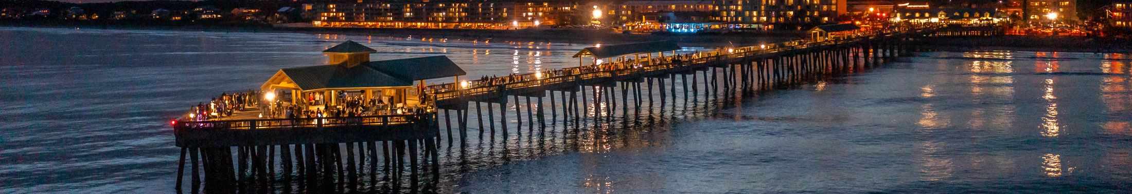 Aerial view of the Folly Beach Pier after dark